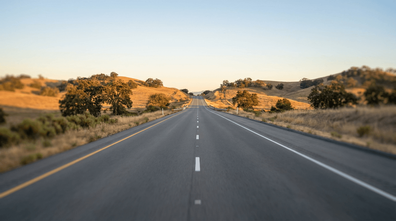 Professional cargo van traveling on highway demonstrating consistent dedicated route service